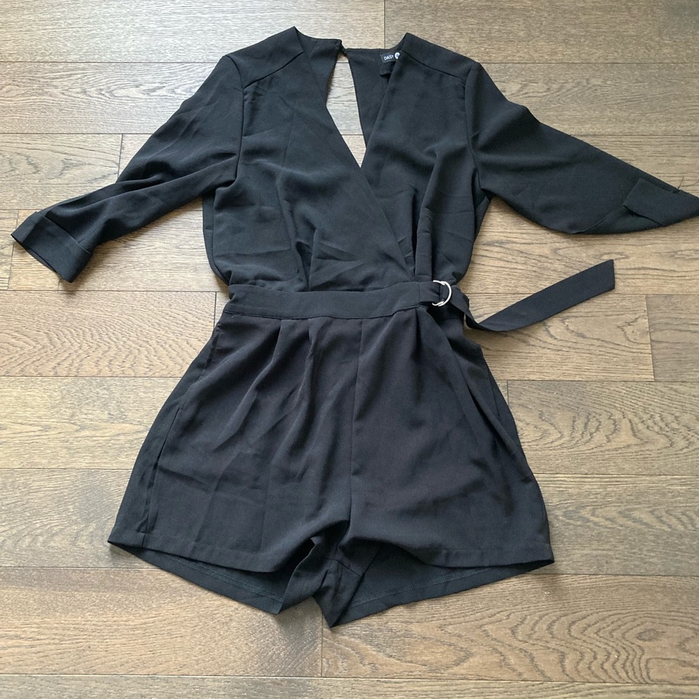 Black open back shorts romper.